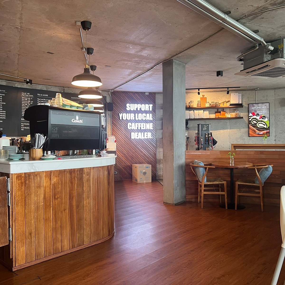 Cannelle Kata coffee counter with timber cladding and concrete columns