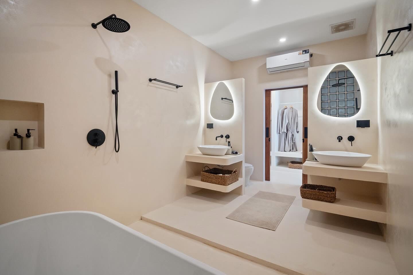 Villa Kyma ensuite bathroom with twin vanities and black fittings